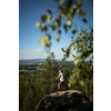 Senior man enjoying the outdoors, hiking, walking throught lovely nature