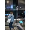 People at an international airport, at the baggage claim zone - motion blurred image