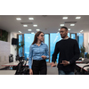 Two happy diverse professional executive business team people woman and African American man walking in a coworking office. Multicultural company managers team portrait. High-quality photo