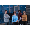 Portrait of a successful creative business team looking at camera and smiling. Diverse businesspeople standing together at startup. Selective focus. High-quality photo