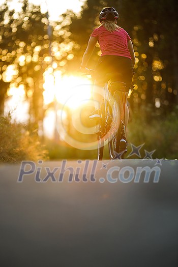 Happy couple riding bicycles outside, healthy lifestyle fun concept, taking a break admiring the view Happy couple riding bicycles outside, healthy lifestyle fun concept, taking a break admiring the view