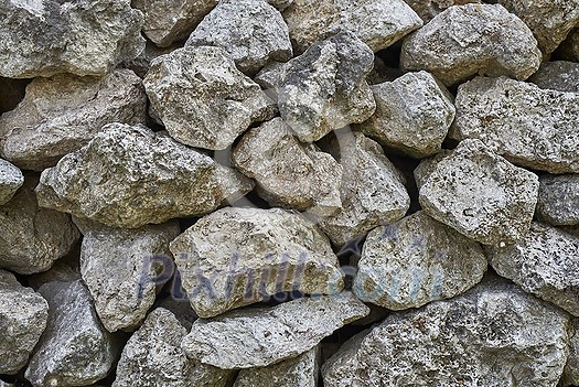 Close up of natural weathered grunge stones with moss and abstract pattern.
