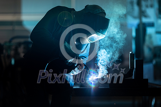 Man working on iron with grinder. Man at work. Sparkles and fire from grinder cutting. Grinder. Worker. Man working on iron with grinder. Man at work. Sparkles and fire from grinder cutting. Grinder. Worker.