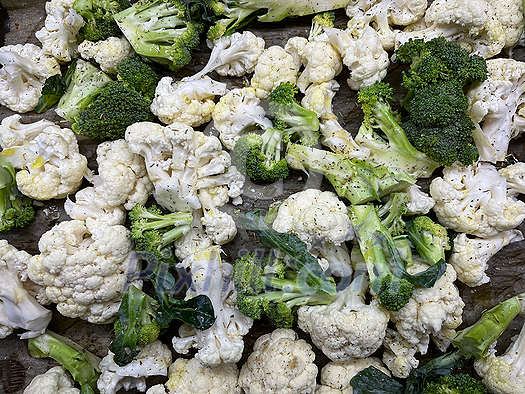 Broccoli and cauliflower cut and ready for cooking, baking, steaming. Healhty lunch or diiner.