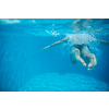 Male swimmer swimming in an outdoor pool - keeping fit