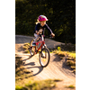Little girl riding with her bike on a pumptrack