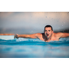 Male swimmer swimming in an outdoor pool - keeping fit