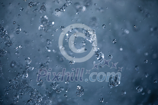 Water concept - river water flowing with light reflecting of its surface - long exposure shot