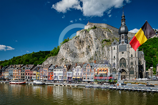 View of picturesque Dinant town, Dinant Citadel and Collegiate Church of Notre Dame de Dinant over the Meuse river. Belgian province of Namur, Blegium View of picturesque Dinant town, Dinant Citadel and Collegiate Church of Notre Dame de Dinant over the Meuse river. Belgian province of Namur, Blegium