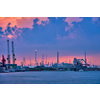 Port of Antwerp with harbor cranes in twilight and a ship passing under brigde Antwerp, Belgium