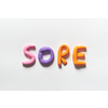 Sore word formed of colored plasticine on white backdrop.