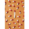 Pharmaceutical pills and medication powder scattered over orange background. Health care and medication-assisted treatment.