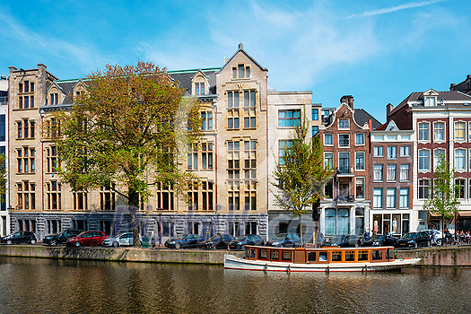 Amsterdam bridge over canal with houses. Amsterdam, Netherlands