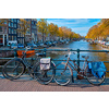 Amterdam cityscape with canal, bridge with bicycles and medieval houses. Amsterdam, Netherlands