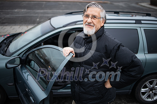 Senior man smiling, happy about his new car