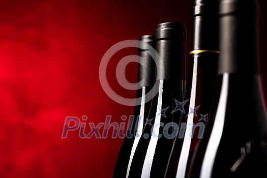 Bottles of quality red wines shot with shallow DOF; color toned image