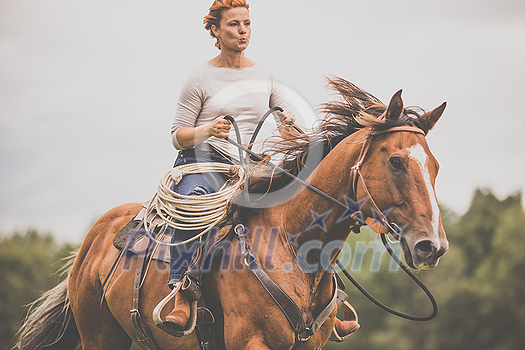 Pretty, young, redhead woman with her lovely horse, during her favorite leisure Pretty, young, redhead woman with her lovely horse, during her favorite leisure