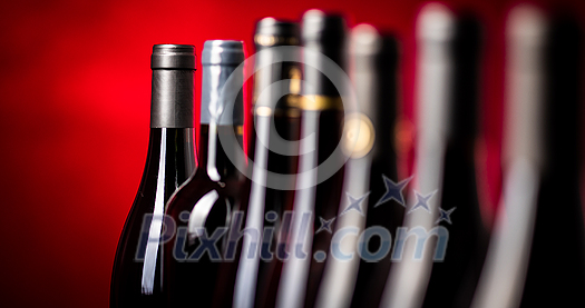 Bottles of quality red wines shot with shallow DOF; color toned image