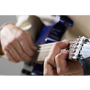 Close up of male hands playing electric guitar