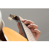 Close up of male hands playing acoustic guitar