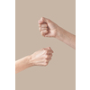 Man and woman hands fist bump alternative symbol of friendship isolated on beige background. Brotherhood awesome fists bump as agreement.