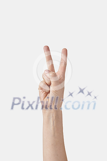 Numeric count on fingers, male hand in vertical position with two, 2, V letter in sign language or finger alphabet isolated on white background. Counting fingers concept. Numeric count on fingers, male hand in vertical position with two, 2, V letter in sign language or finger alphabet isolated on white background. Counting fingers concept.