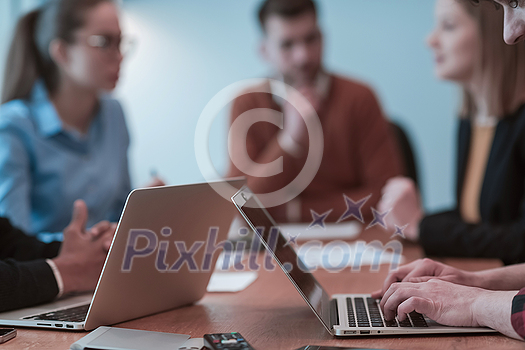 Successful team. Group of young multi-ethnic business people working and communicating together in creative office. Selective focus. High-quality photo