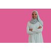 Portrait of young modern Muslim African beauty wearing traditional Islamic clothes on plastic pink background. Selective focus. High-quality photo