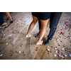 Couple dancing on a dance floor during a wedding celebration/party (motion blurred image)