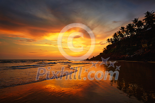 Sunset on Varkala beach popular tourist destination in Kerala state, South India