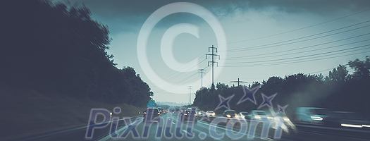 Cars on a highway at a rainy dusk (shallow DOF; color toned image) Cars on a highway at a rainy dusk (shallow DOF; color toned image)