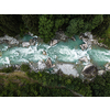 Aerial top view of a splendid whitewater on a mountain river in Swiss Alps