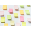 Blank colorful sticky notes with shadow over white background.