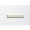 Disease word formed of scrabble blocks on white background. Disease prevention and physical health awareness.