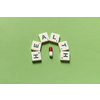 Health word formed of scrabble blocks and pharmaceutical pill over green background. Health and medical treatment concept.