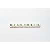 Diagnosis word formed of scrabble blocks on white background. Disease prevention and physical health awareness.