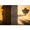 Old lantern in warm evening light in an old downtown street