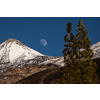 Colorful scenic landscape of moon rise in Tenerife national park of Teide. El Teide with moon rising by its side.