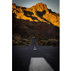 Long road in a mountain valley with a car on it - Teide National Park, Tenerife, Canary islands