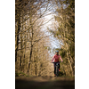 Pretty, young woman with her mountain bike going for a ride past the city limits, getting the daily dose of cardio