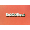 Problem word formed of scrabble blocks on red background. Creative template with copy space.