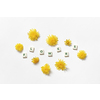 Flowers word formed of scrabble tiles with fresh dandelions on white background.