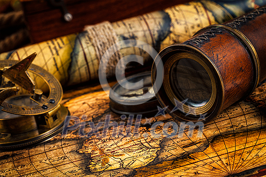 Travel geography navigation concept background - old vintage retro compass with sundial, spyglass on ancient world map Travel geography navigation concept background - old vintage retro compass with sundial, spyglass on ancient world map