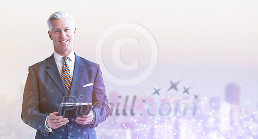 Portrait of senior businessman using tablet in front of big modern city Portrait of senior businessman using tablet in front of big modern city