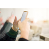 young female student using a mobile phone during the break in the electronics classroom