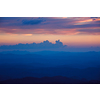 Silhouettes of hills in valley on sunset. Pothamedu viewpoint, Munnar, Kerala, India