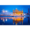 Sikh sacred site gurdwara Sri Harmandir Sahib (also known as The Golden Temple, also Darbar Sahib) illuminated at night. Amritsar, Punjab state, India