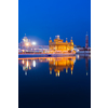 Sikh sacred site gurdwara Sri Harmandir Sahib (also known as The Golden Temple, also Darbar Sahib) illuminated at night. Amritsar, Punjab state, India