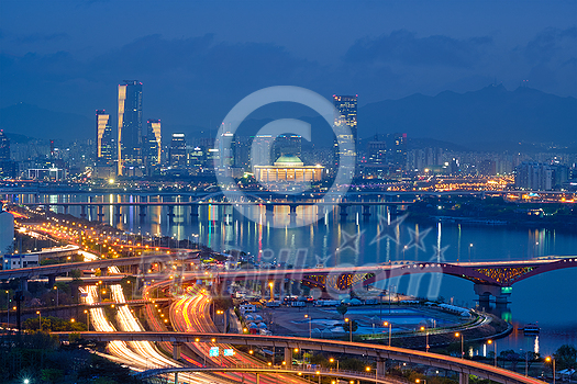 Aerial view of Seoul downtown cityscape and Seongsan bridge over Han River in twilight. Seoul, South Korea.