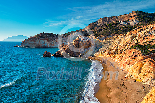 Agios Ioannis greek beach and Aegean sea on sunset. Milos island, Greece Agios Ioannis greek beach and Aegean sea on sunset. Milos island, Greece